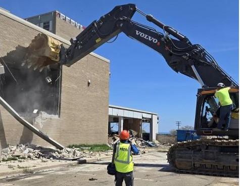 Crews in 2025 begin demolishing YMCA building.  