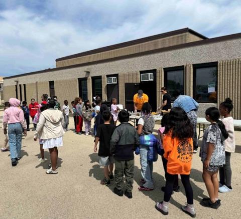 Kids served by the Benner program line up. 