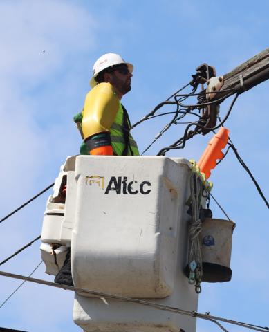 File photo of lineman working in a bucket. 