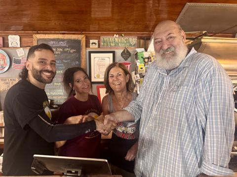 L-r, new Frank's owners Pablo and Diana Escribano and soon-to-be former owners Julie Rittmiller and Kevin Ervin. 
