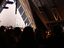 Attendees hold candles at a vigil in Kenosha for people who have died at the hands of ICE. 